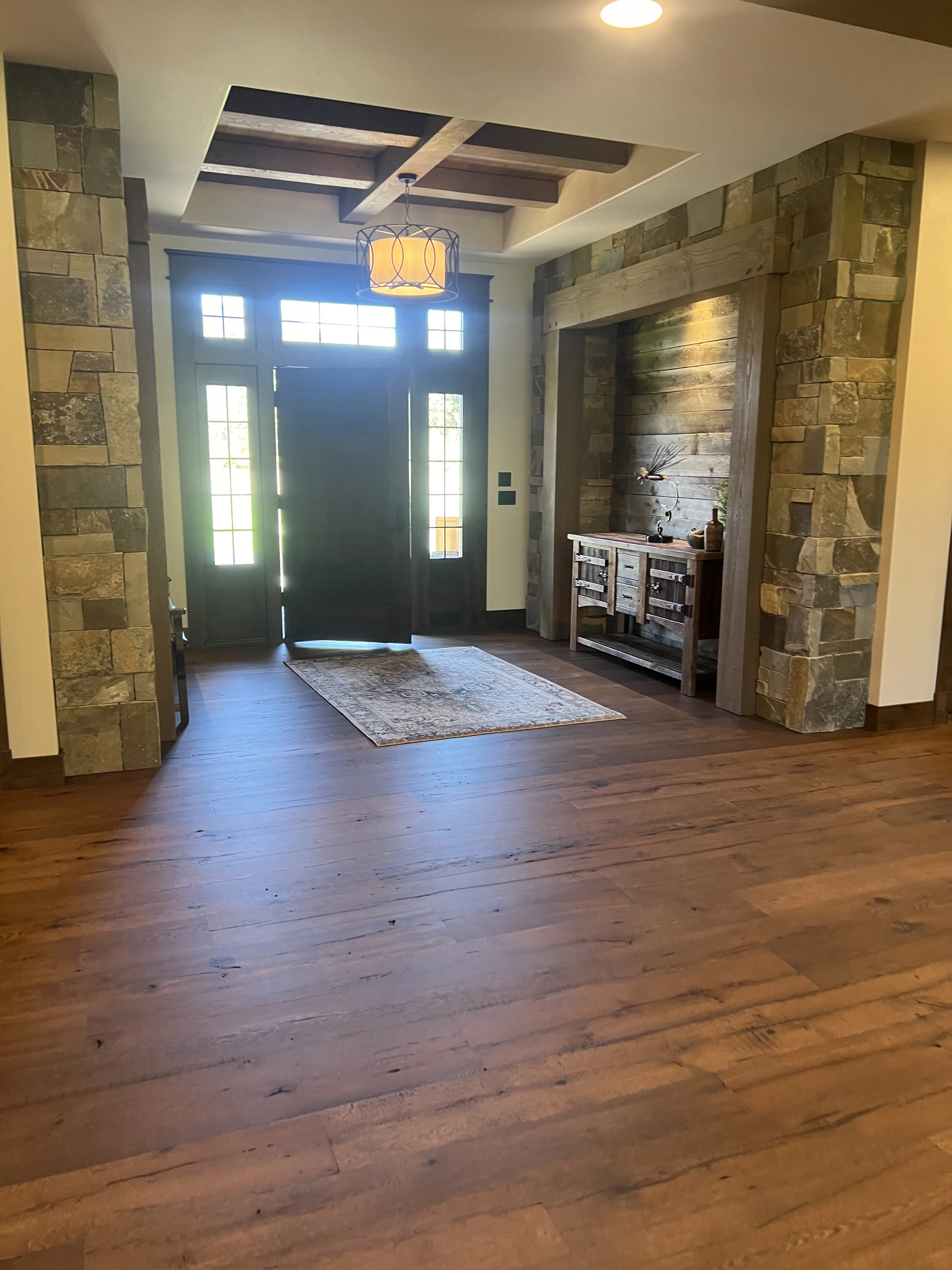 Front entrance with hardwood floor in a featured Winnwood Flooring project